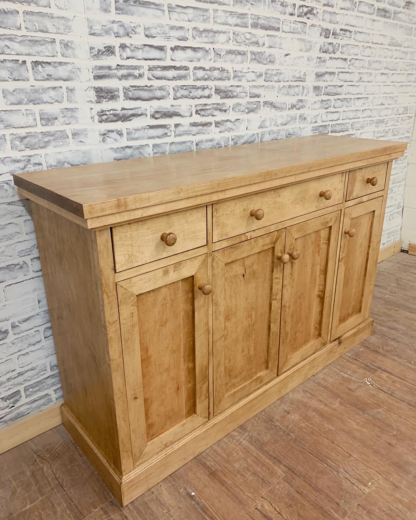 Pictured with a 60" L x 18" D x 36" T server in Hard Maple stained Early American.