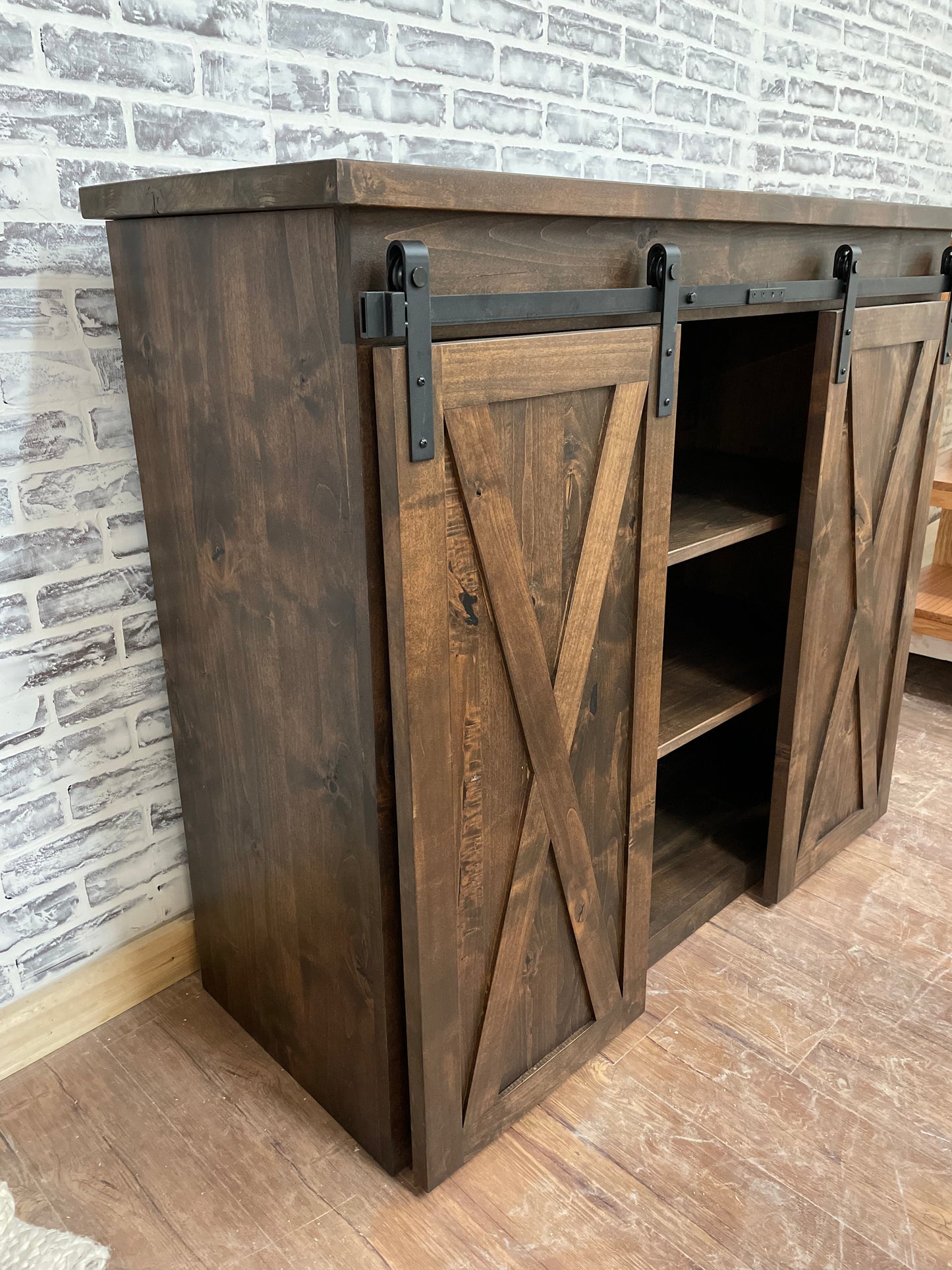 Pictured is a 48" L x 35" T x 18" D console made in solid Rustic Alder and stained Espresso.