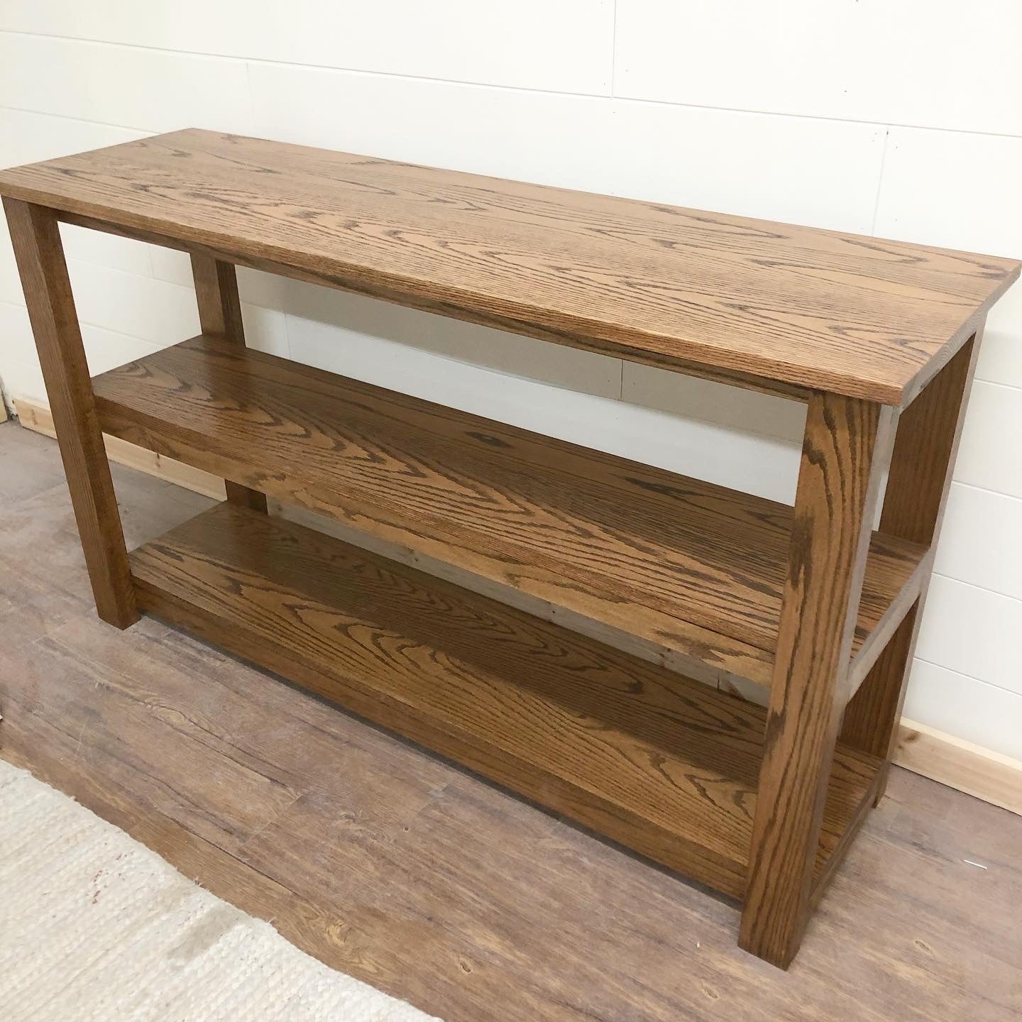 Pictured with a 60" L x 18" D x 36" T Red Oak sofa table stained in Honey.