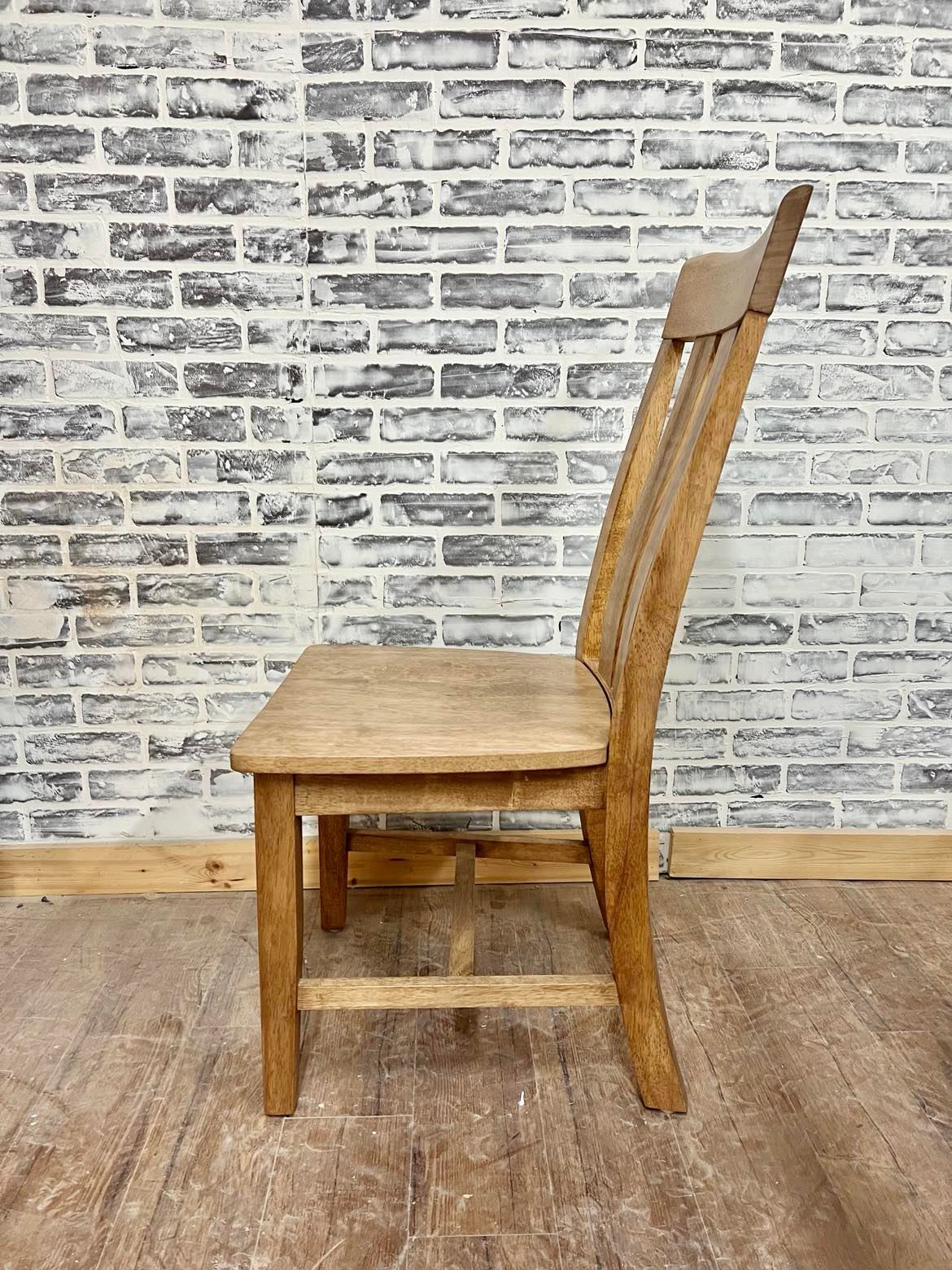 Pictured with the Ava Dining Chair in Early American stain.