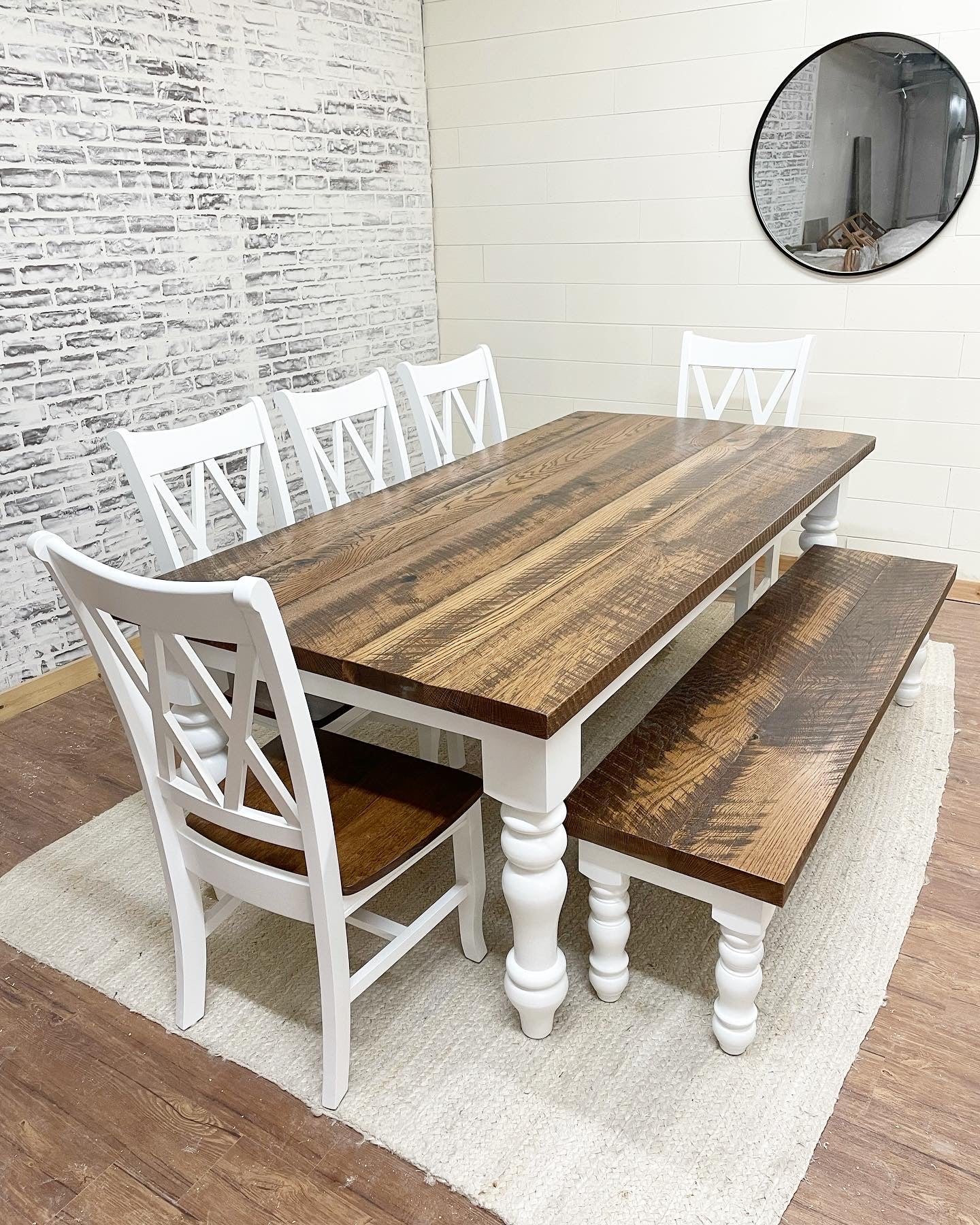 Pictured with an 8' L x 42" Rustic White Oak top stained Early American and a painted white base. Pictured with a Matching Bench and 5 Double Cross Back Chairs.