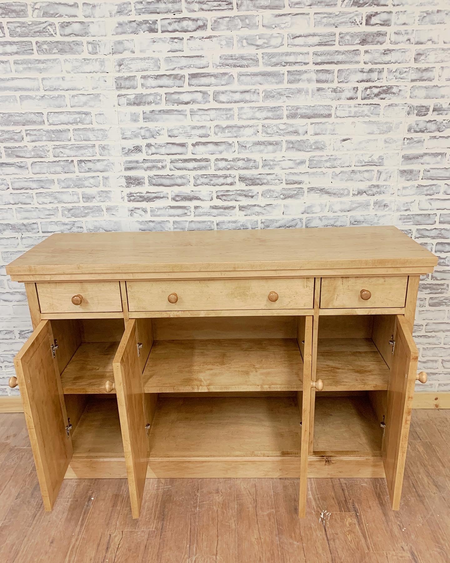 Pictured with a 60" L x 18" D x 36" T server in Hard Maple stained Early American.