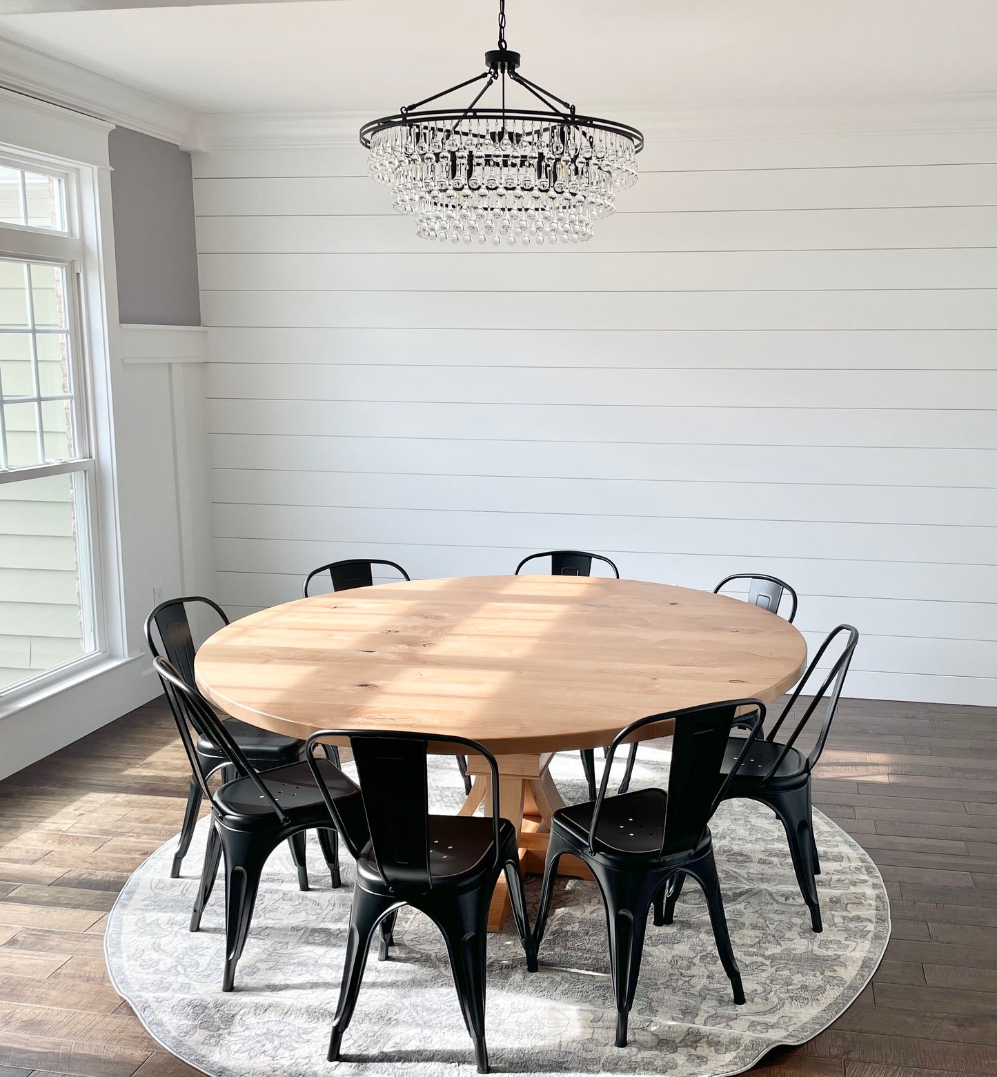 Pictured is a 72" W Rustic Alder table is a Natural Finish. Pictured is 8 Metal Chairs is a Black Finish.