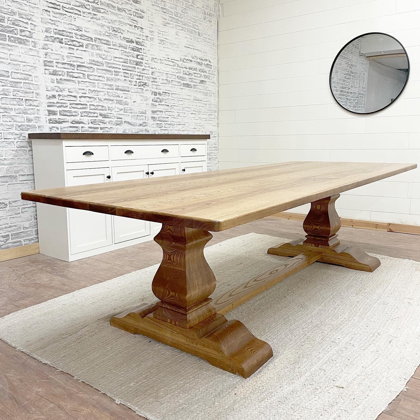 Pictured with a 9' L x 42" W Ash top with rounded corners stained Early American.