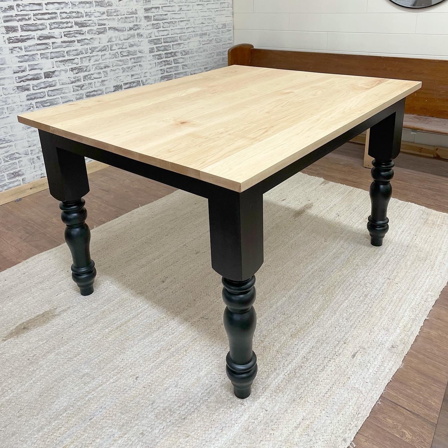 Pictured with a 60" L x 48" W Hard Maple top with a Natural Finish and Black painted base.