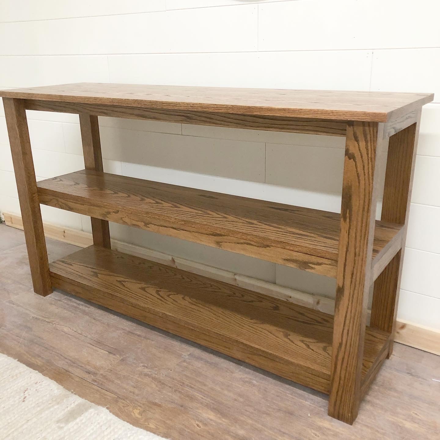 Pictured with a 60" L x 18" D x 36" T Red Oak sofa table stained in Honey.