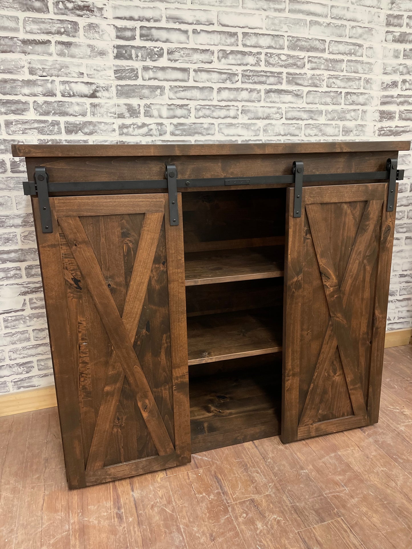 Pictured is a 48" L x 35" T x 18" D console made in solid Rustic Alder and stained Espresso.
