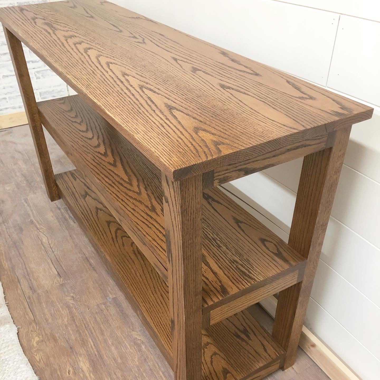 Pictured with a 60" L x 18" D x 36" T Red Oak sofa table stained in Honey.