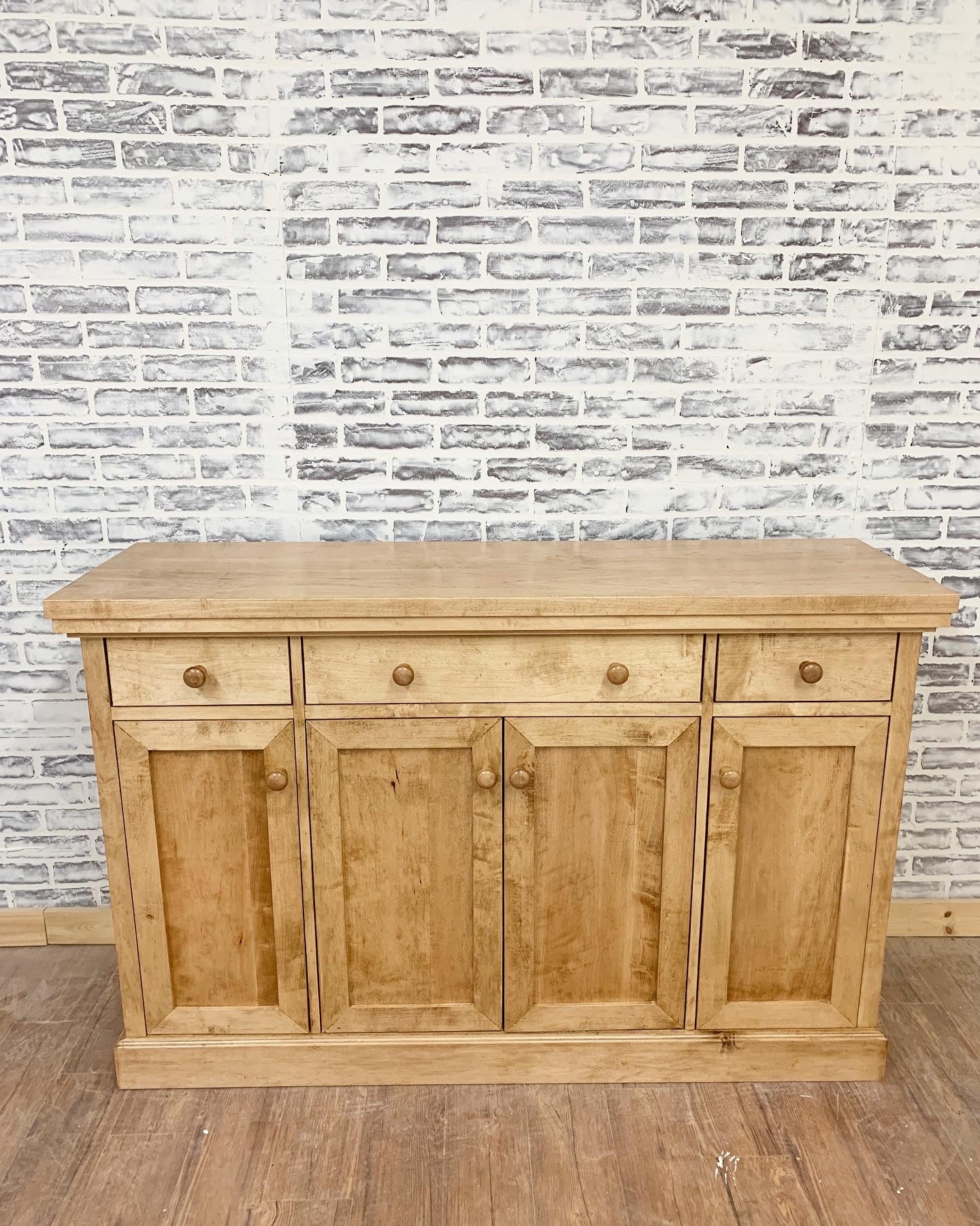 Pictured with a 60" L x 18" D x 36" T server in Hard Maple stained Early American.