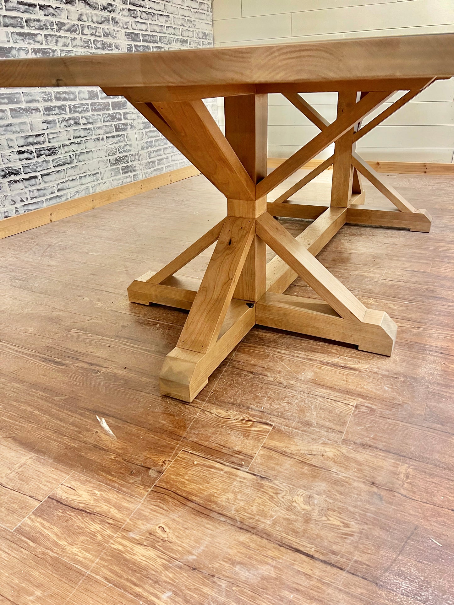 Pictured with a 9' L x 42" W Rustic Alder table stained Weathered Oak.