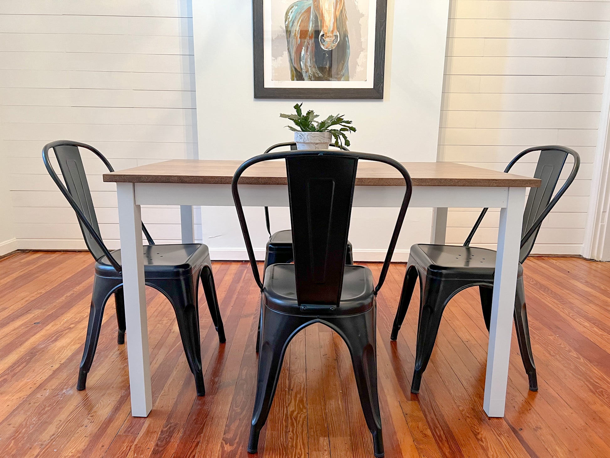 Pictured with a 48" L x 30" W hard maple table with Espresso stain and white painted base. Also pictured with 4 metal dining chairs.