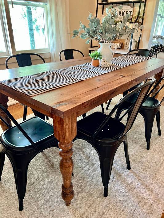 Pictured with a 6' L x 36" W Rustic Farm Table stained Early American. Pictured with 6 Matte Black Metal Dining Chairs.