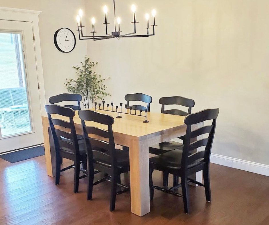 Pictured is a 5.5' L x 42" W White Oak table with Pickled Oak stain. Pictured are 6 French Country Chairs painted Black.