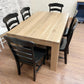 Pictured is a 5.5' L x 42" W White Oak table with Pickled Oak stain. Pictured are 6 French Country Chairs painted Black.