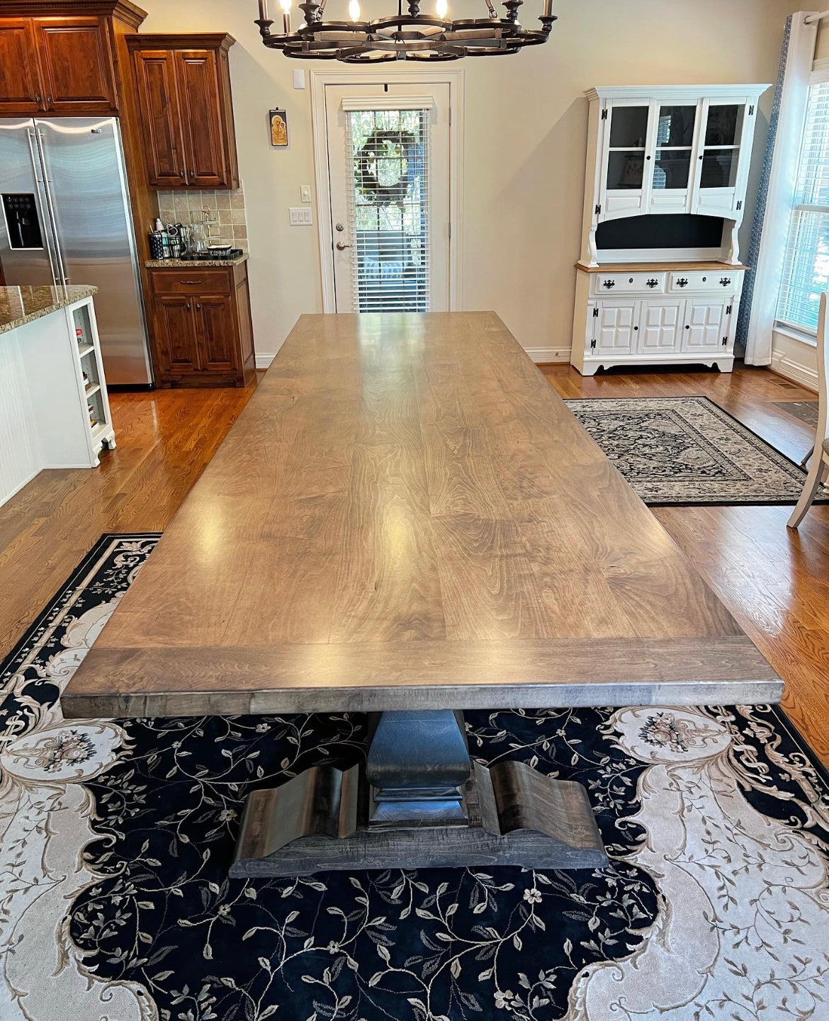 Pictured with a 12' L x 42" W Hard Maple table with 5" Breadboards stained in Expresso.