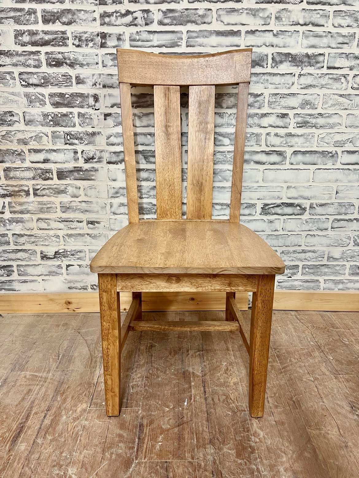 Pictured with the Ava Dining Chair in Early American stain.