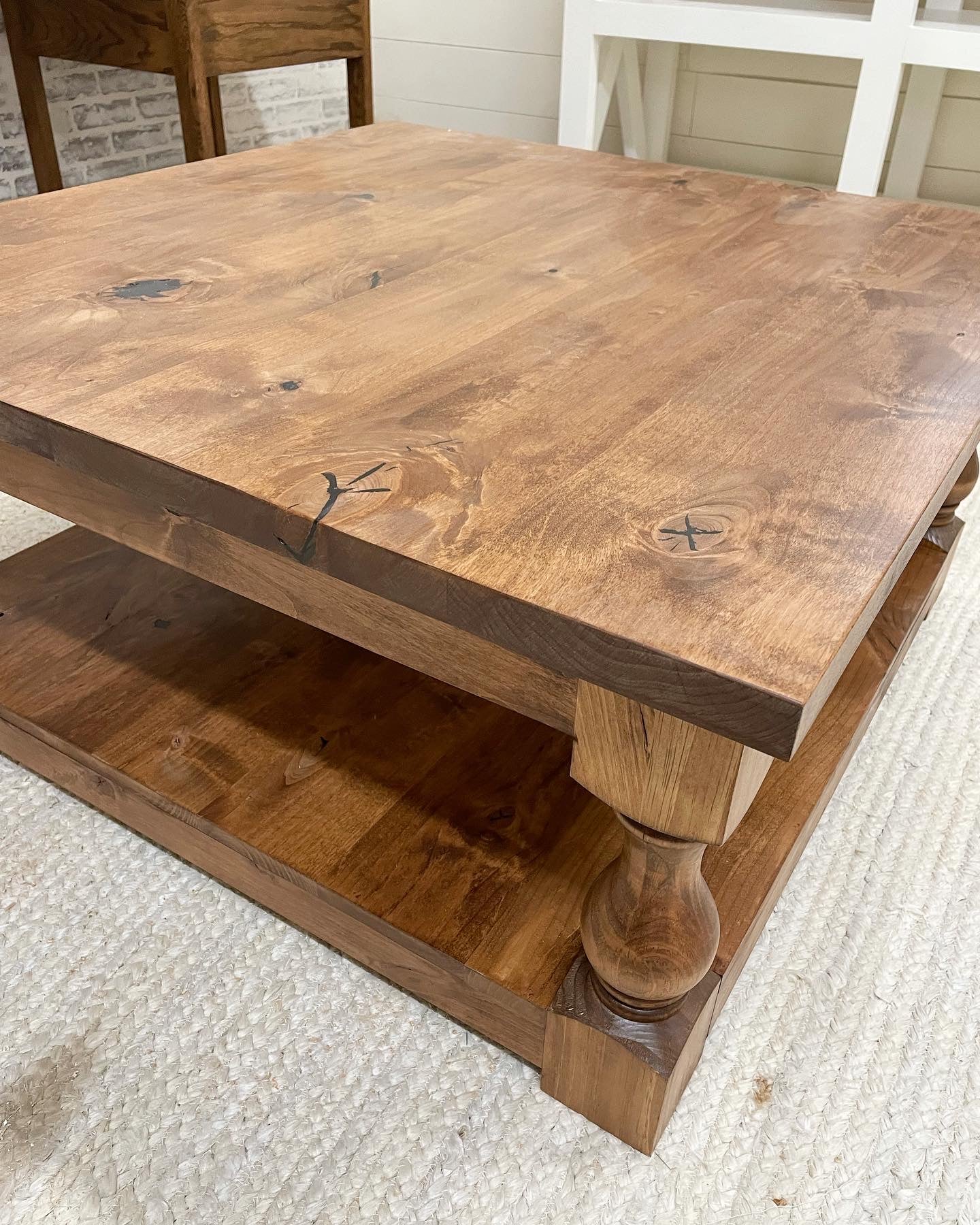 Pictured with a 36" X 36" Rustic Alder table stained Honey.