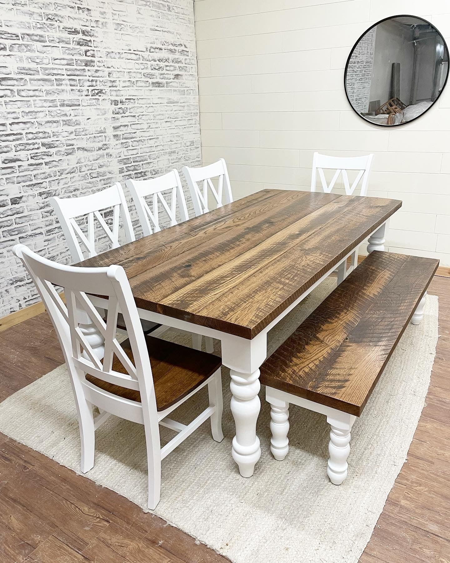 Pictured with an 8' L x 42" Rustic White Oak top stained Early American and a painted white base. Pictured with a Matching Bench and 5 Double Cross Back Chairs.