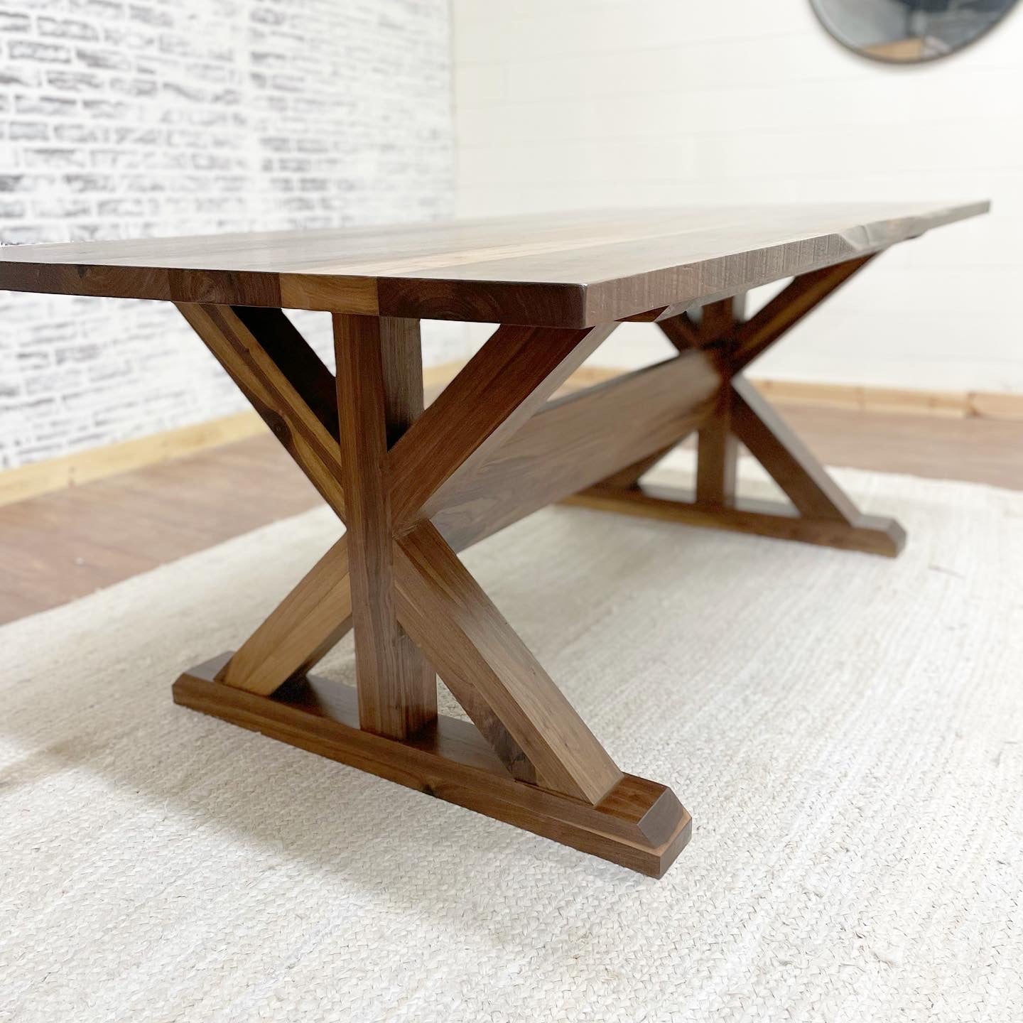 Picutred with a 7' L x 42" W Walnut table with a Natural Finish.