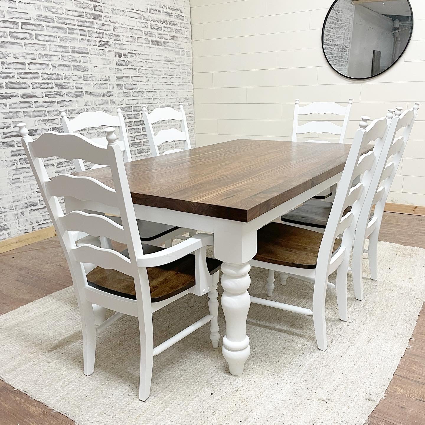 Pictured with a 6'L x 42" W Walnut top with a Natural finish and a painted White base. Pictured with 4 Maine Ladder Back Chairs and two Captain Chairs.