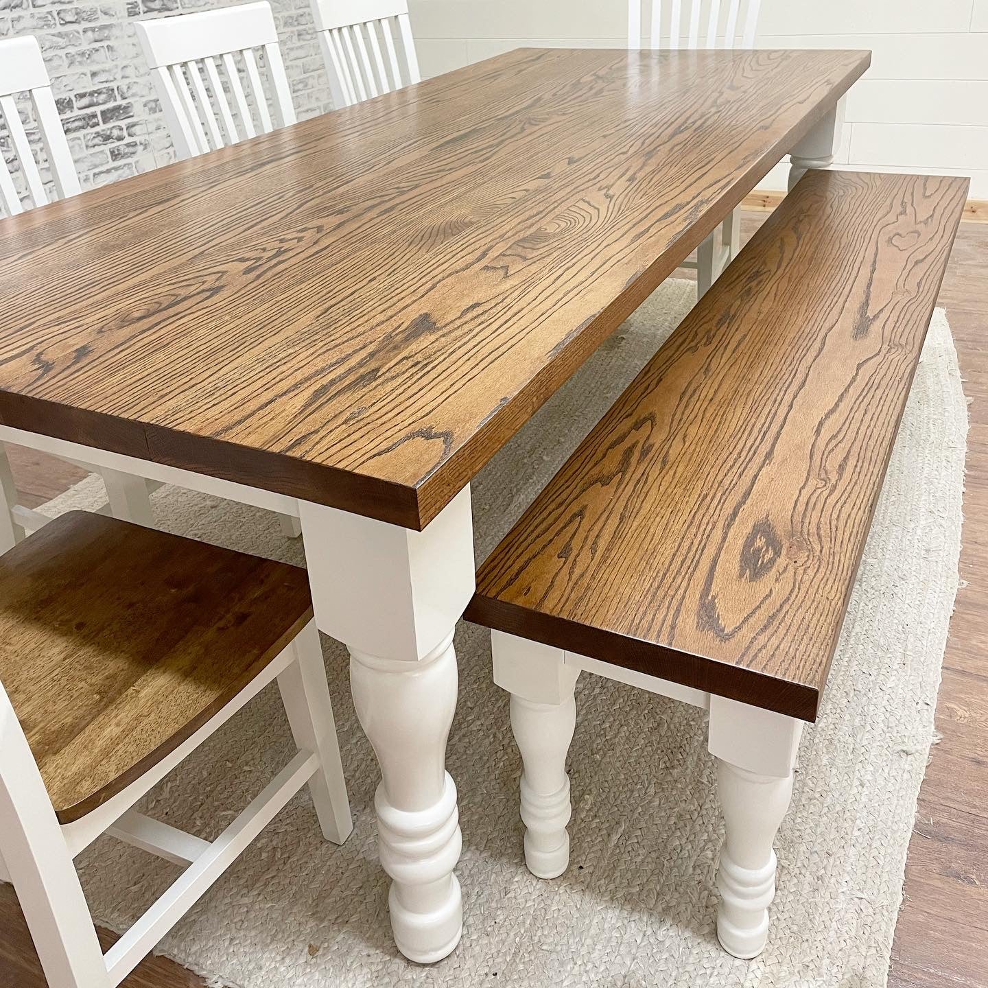 Pictured with an 8' L x 42" Red Oak top stained Honey with a painted White base. Pictured with a Matching Bench and 5 Mission Dining Chairs.