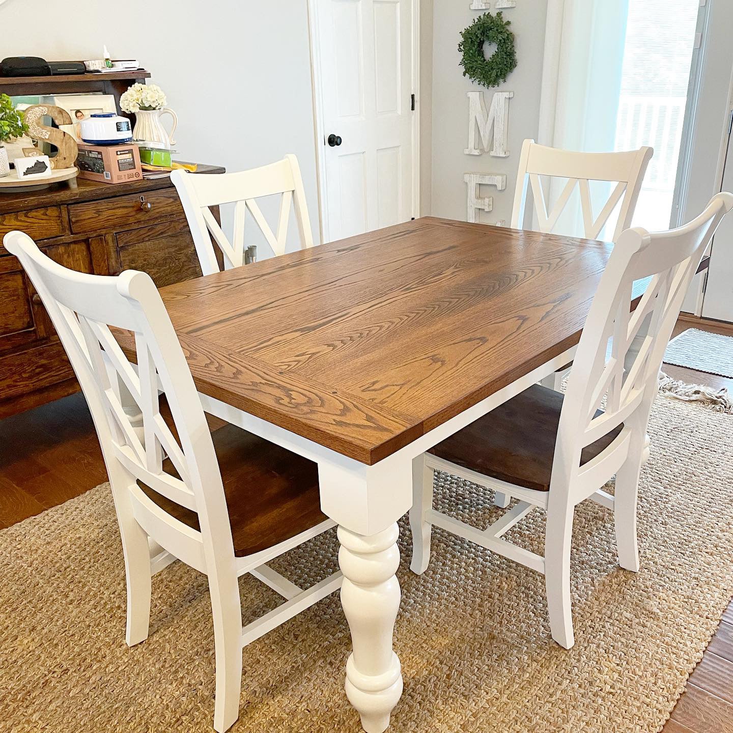 Pictured with a 5' L x 42" W Red Oak top with a Bread Board stained Honey with a White painted base. Pictured with 4 Double Cross Back Chairs.