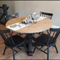 Pictured with a 42" Rustic Alder table stained Weathered Oak and Black Stained Base. Pictured with four Lexington Chairs stained Black.