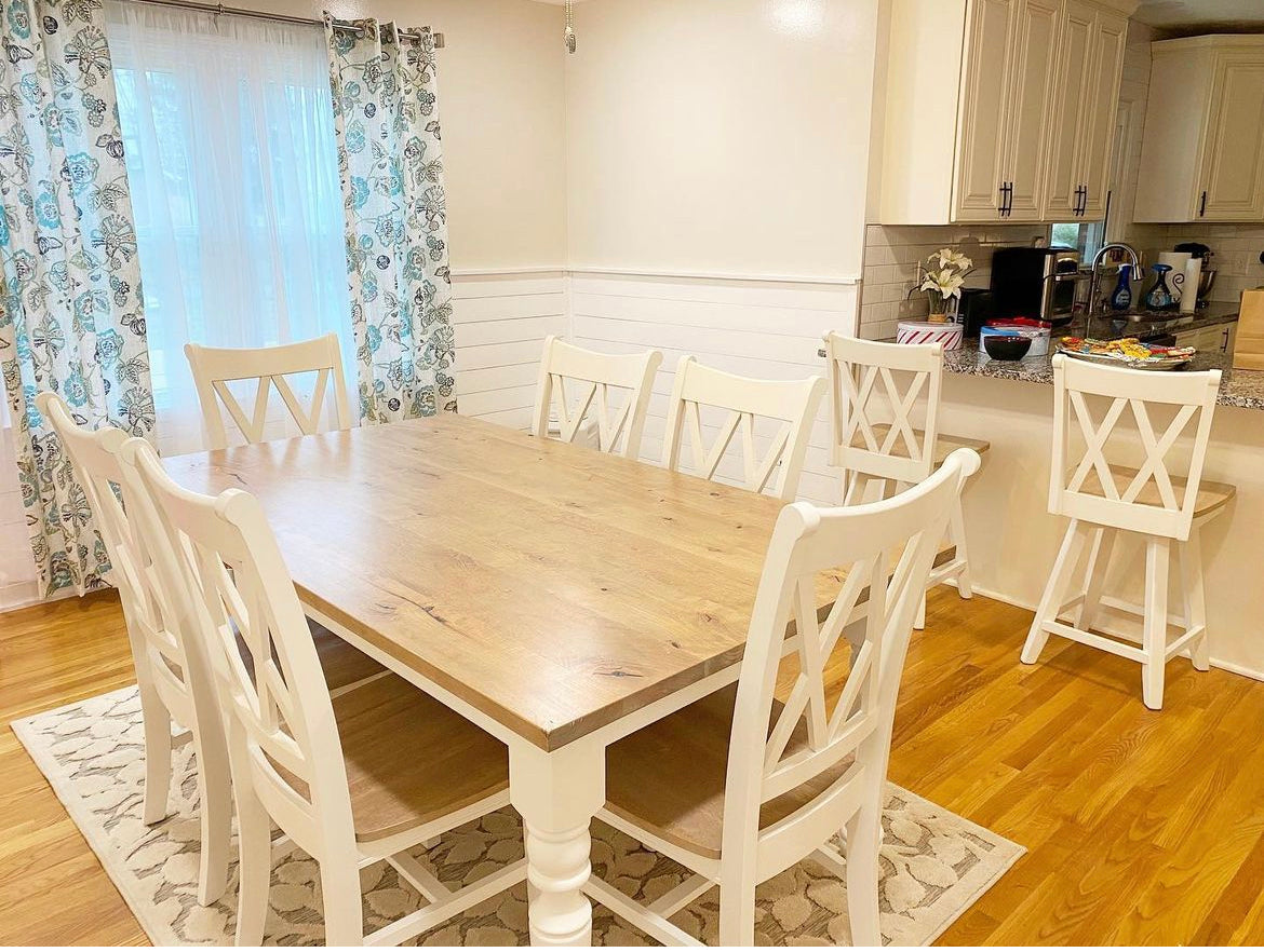 Pictured with a 6' L x 42" W Rustic alder top stained Weathered Oak and a White painted base. Pictured with 6 Double Cross Back Chairs and two Counter Height Swivel Stools.