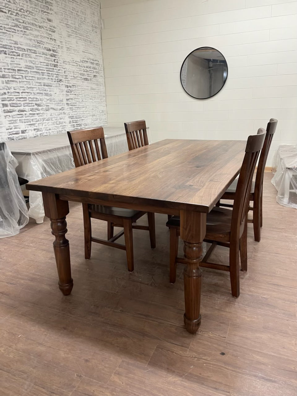 Pictured with a 6' L x 42" W solid Walnut table with a Natural Finish. Pictured with four Mission Chairs. 