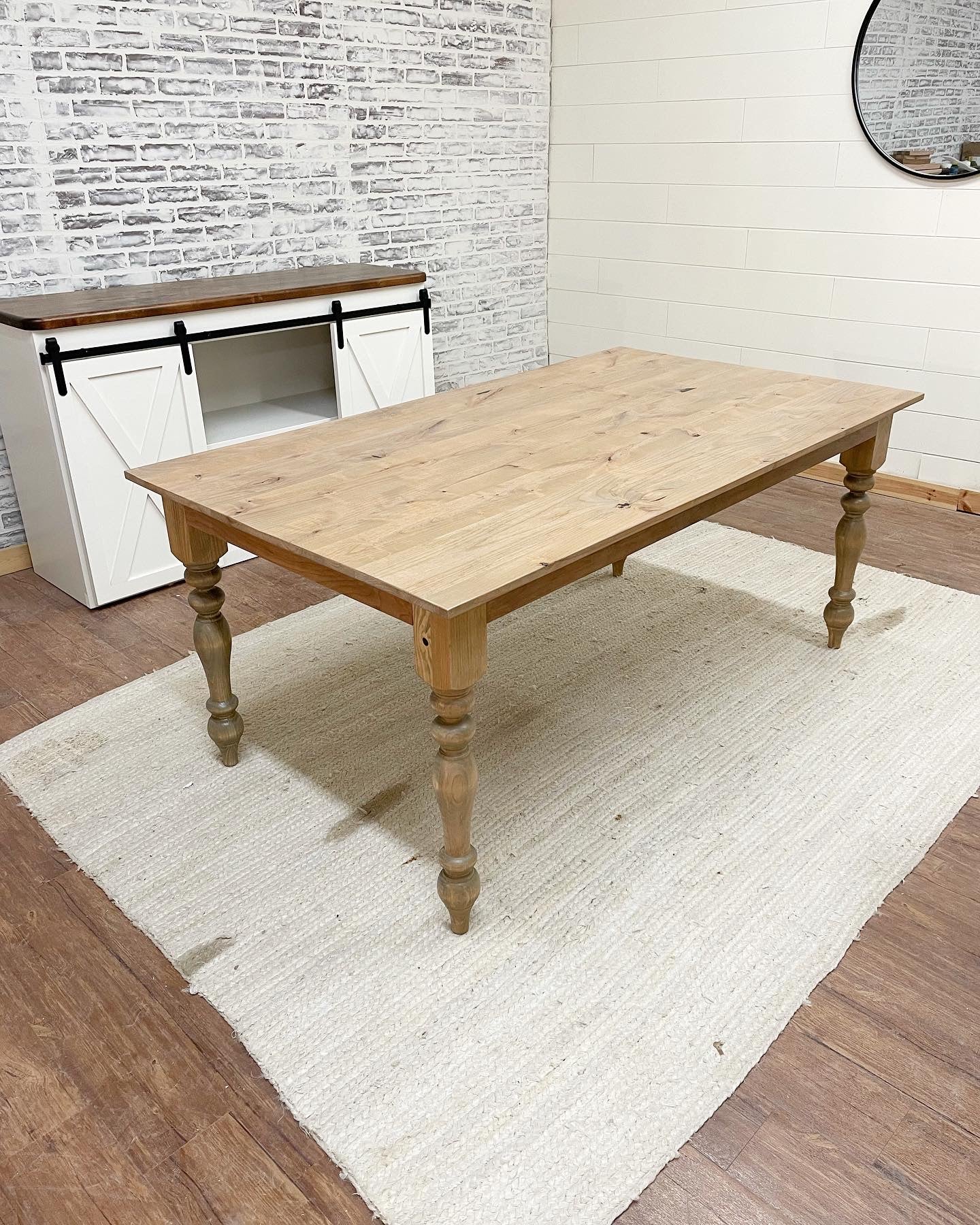 Pictured with a 6' L x 42" W Rustic Alder Top with Pine Legs stained Weathered Oak. Pictured with a 5' L x 34.5" T x 18" D Sliding Barn Door Console with Red Oak Top stained Espresso and  White painted base.