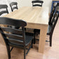 Pictured is a 5.5' L x 42" W White Oak table with Pickled Oak stain. Pictured are 6 French Country Chairs painted Black.
