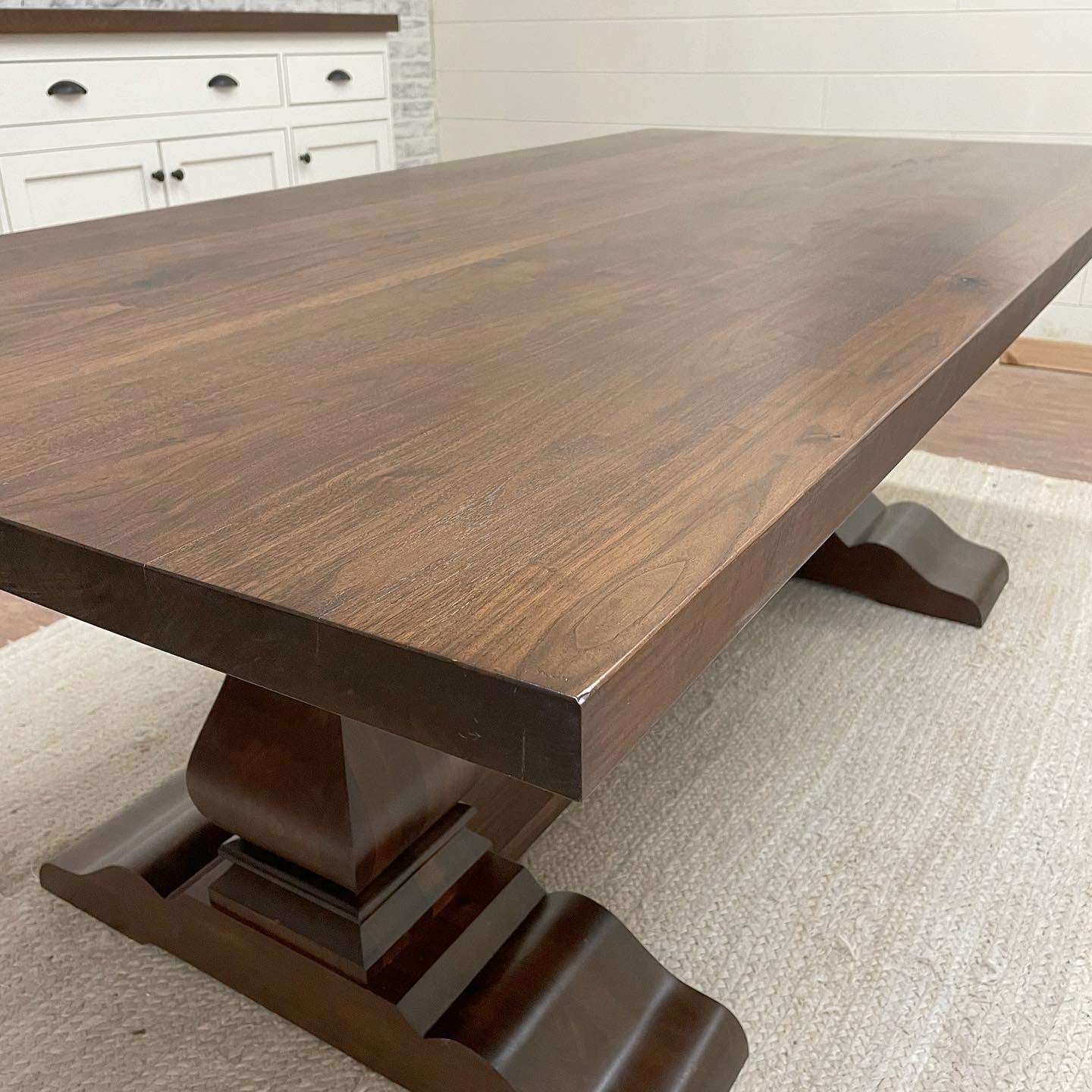 Pictured with a 7' L x 42" W Walnut dining table stained Honey.