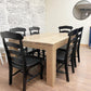 Pictured is a 5.5' L x 42" W White Oak table with Pickled Oak stain. Pictured are 6 French Country Chairs painted Black.