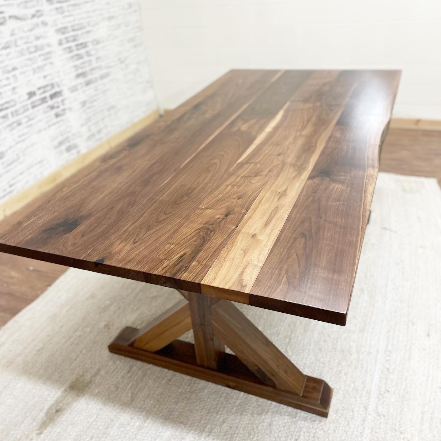 Picutred with a 7' L x 42" W Walnut table with a Natural Finish.