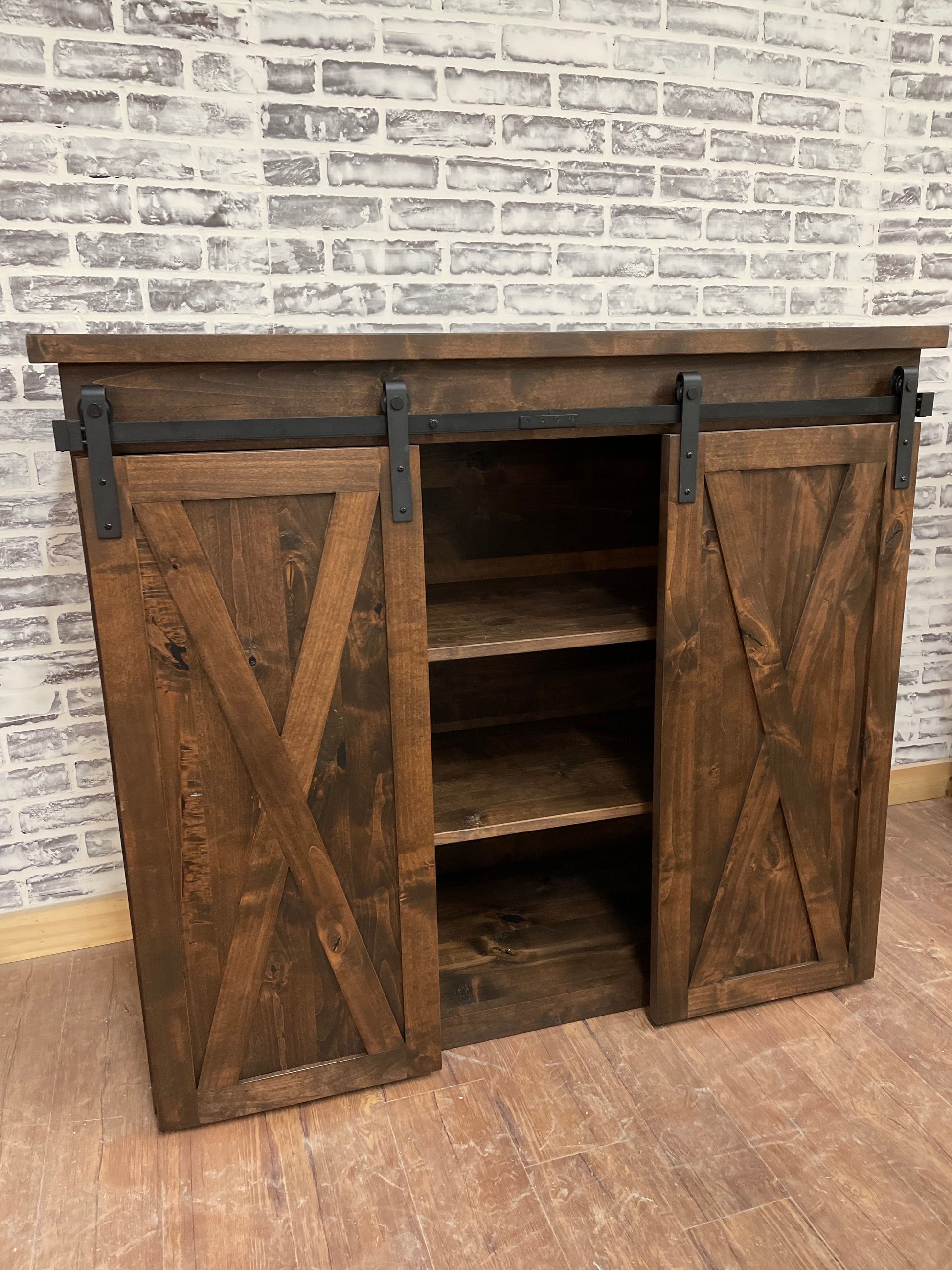 Pictured is a 48" L x 35" T x 18" D console made in solid Rustic Alder and stained Espresso.