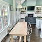 Pictured is a 7' L x 36" W Hard Maple table with a Natural Finish. Pictured is 6 Metal Chairs in a Gun Finish.