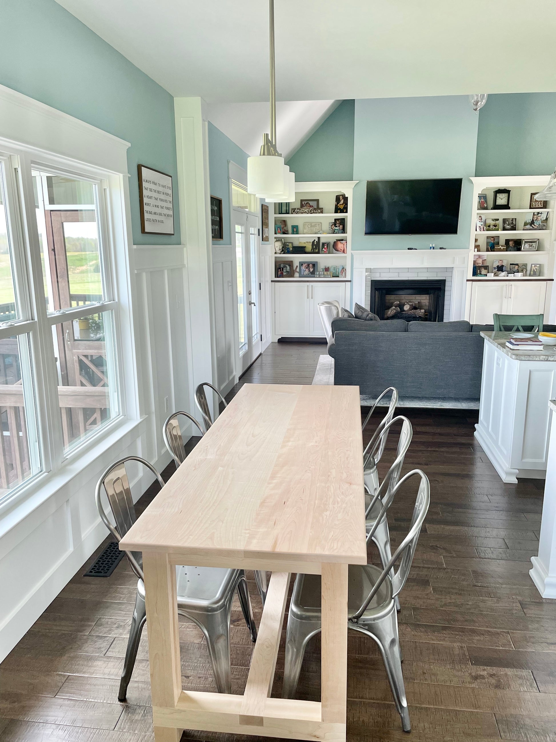 Pictured is a 7' L x 36" W Hard Maple table with a Natural Finish. Pictured is 6 Metal Chairs in a Gun Finish.