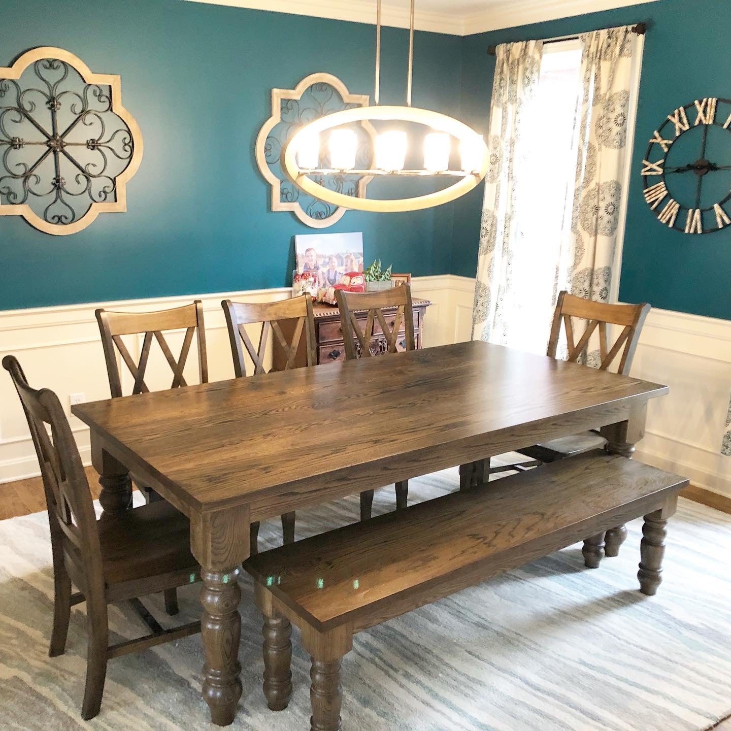 Pictured with a 7' L x 42" W White Oak table with matching White Oak Legs stained Espresso. Pictured with a Matching Bench and 5 Double Cross Back Chairs.
