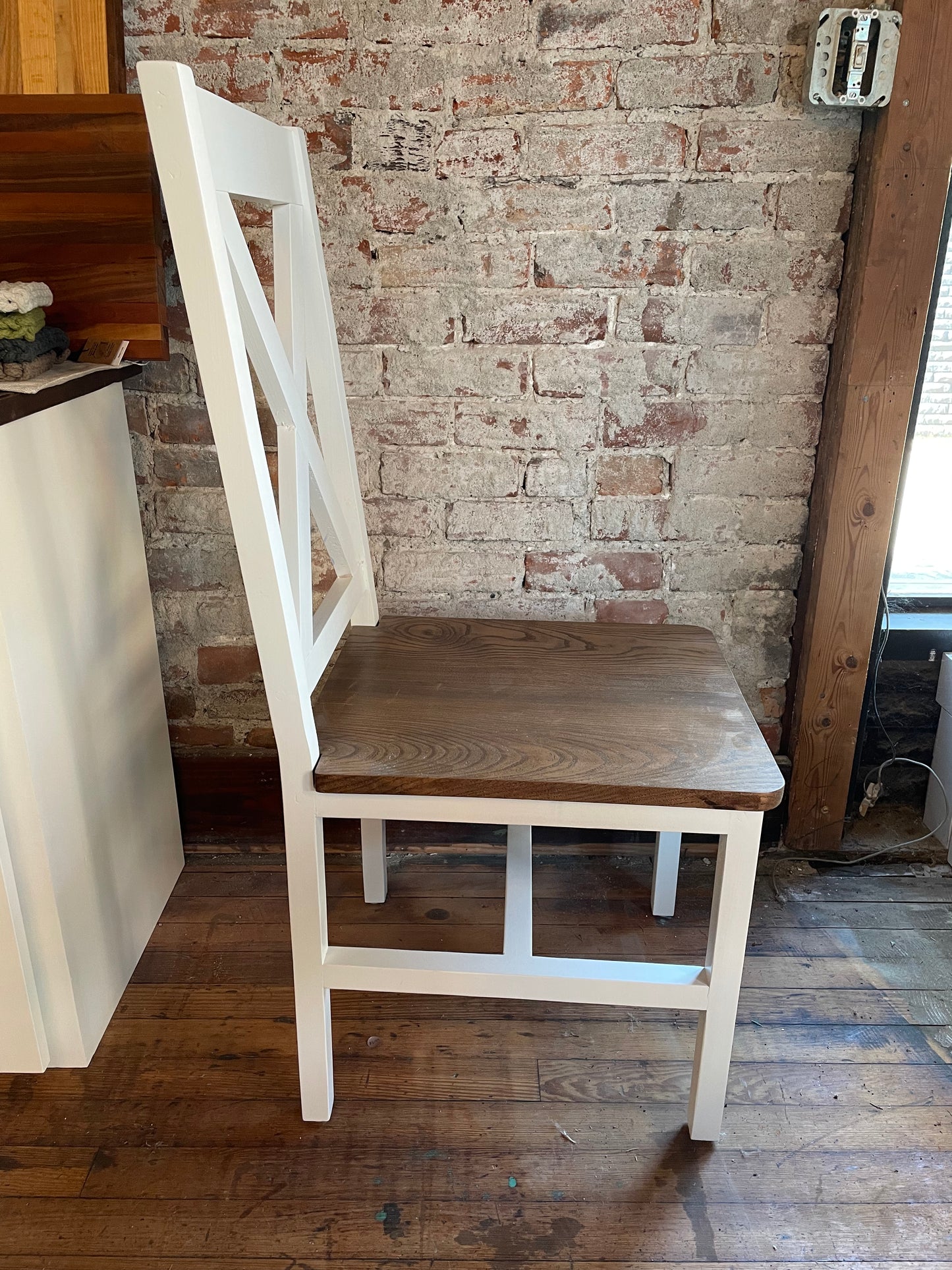 Custom made dining chair with a single X for a supportive back painted white with a espresso stained oak seat.