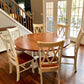 Pictured with a 60" W Red Oak table stained Cherry with a white painted base. Pictured with 6 Double Cross Back Chairs.